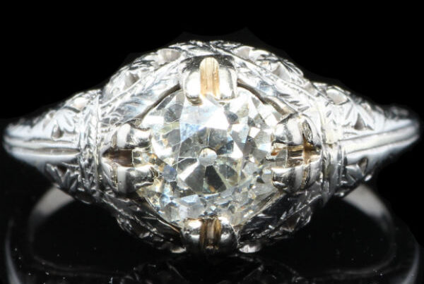 Vintage filigree diamond engagement ring close-up