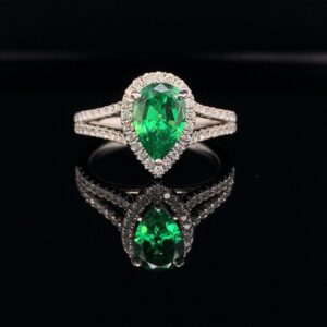This 14k White Gold Split Shank Halo is 1.50 CTW, including the stunning Pear Shape Green Emerald!!! Inquire Now!!! Available for only $1999!!!