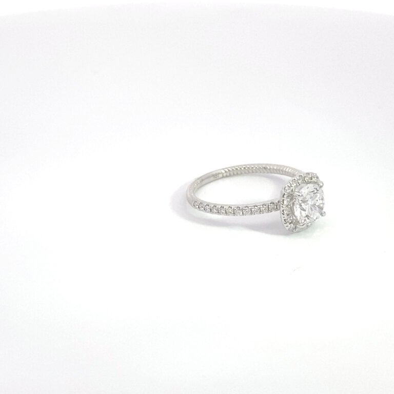 halo diamond engagement ring on white background