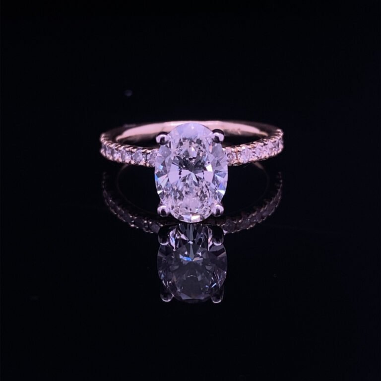 Oval diamond pave engagement ring reflection