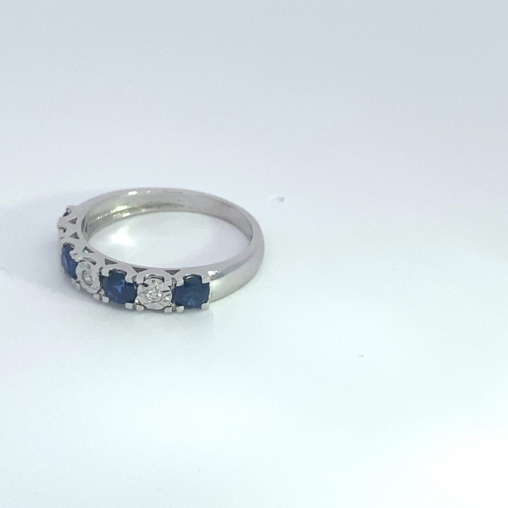 Silver ring with blue sapphires and diamonds