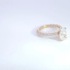 Gold diamond engagement ring on white background Gold diamond engagement ring on white background