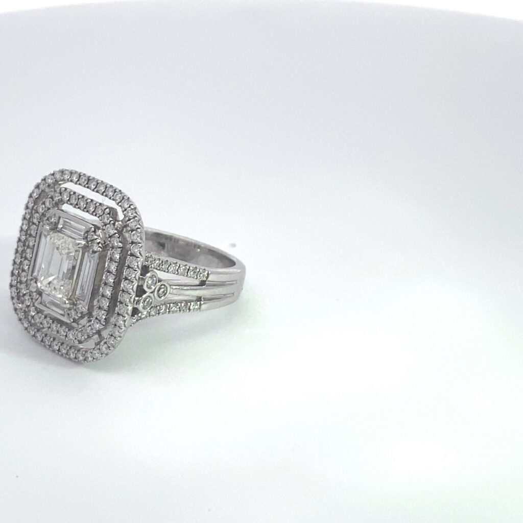 Emerald-cut diamond halo engagement ring
