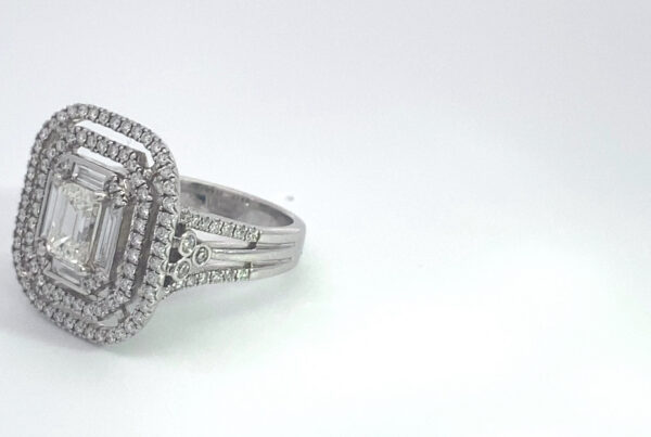 Emerald-cut diamond halo engagement ring