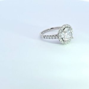 Halo diamond engagement ring on white background 14K white gold halo ring with 4 carat oval lab-grown diamond, pavé halo and diamond-accented band